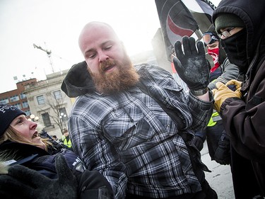 Groups opposed to Canada’s support of the UN Global Compact for Safe, Orderly and Regular Migration held a rally to protest the United Nation Global Compact for Migration while anti-fascism and anti-racism activists counter-protested, Saturday, Dec. 8, 2018 on Parliament Hill. A far-right supporter after a scuffle with police and counter protestors.