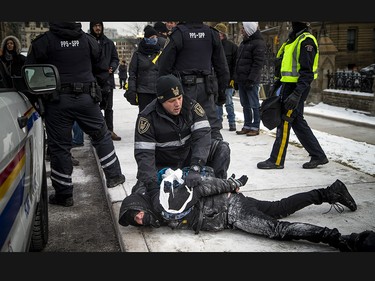 Groups opposed to Canada’s support of the UN Global Compact for Safe, Orderly and Regular Migration held a rally to protest the United Nation Global Compact for Migration while anti-fascism and anti-racism activists counter-protested, Saturday, Dec. 8, 2018 on Parliament Hill. PPS and RCMP detain an anti-fascism and anti-racism activist.