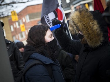 Anti-fascism and anti-racism activists stood in front of the Ottawa police station Saturday, Dec. 8, 2018, waiting for an activist to be released from custody.