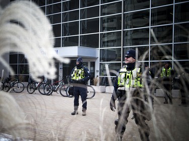 Anti-fascism and anti-racism activists stood in front of the Ottawa police station Saturday, Dec. 8, 2018, waiting for an activist to be released from custody.