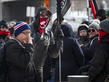Anti-fascism and anti-racism activists stood in front of the Ottawa police station Saturday, Dec. 8, 2018, waiting for an activist to be released from custody.