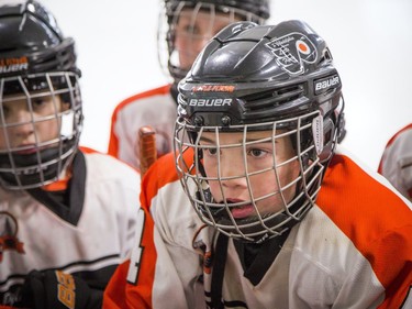 The Major Atom AAA Philadelphia Little Flyers played the Nepean Raiders at the Bell Sensplex Saturday December 29, 2018, part of the Bell Capital Cup. Philadelphia Little Flyers, including #4 Dylan Orr, gathered at the boards to listen to the coaches.