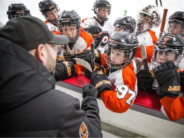 The Major Atom AAA Philadelphia Little Flyers played the Nepean Raiders at the Bell Sensplex Saturday December 29, 2018, part of the Bell Capital Cup. Philadelphia Little Flyers, including #97 Cole Gargon, gathered at the boards for a pep talk and to listen to the coaches.