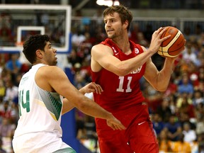Aaron Doornekamp of Team Canada looks for a pass around Leonardo Meindl of Team Brazil in the gold-medal game during the 2015 Pan Am games. (DAVE ABEL/Postmedia Network)