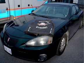 Brockville police released this image of a vehicle and vest seized in a multi-agency raid against the Outlaws motorcycle gang on Thursday.