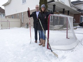 Cory and Lisa Cosgrove had to remove the boards from their rink to comply with a city bylaw after a complaint from a neighbour.