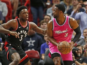 Raptors forward OG Anunoby defends against Miami Heat guard Dwyane Wade during Wednesday night's game. (AP PHOTO)