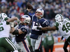 New England Patriots’ quarterback Tom Brady threw for 250 yards and four touchdowns yesterday against the New York Jets. (Getty Images)