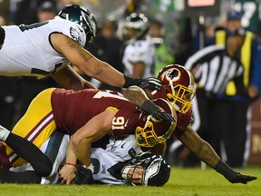 Philadelphia Eagles quarterback Nick Foles left yesterday’s game with a chest injury after being sacked by Washington Redskins linebacker Ryan Kerrigan. The Eagles beat the Redskins 24-0 and made the playoffs. (Getty images)