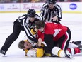 Linemen pull Senators right-winger Bobby Ryan (9) off Predators centre Kyle Turris after their fight during the second period of Monday's game at Canadian Tire Centre.