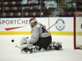 Team Canada goaltender Ian Scott keeps his eye on the puck during selection camp at the Q Centre in Victoria on Tuesday.