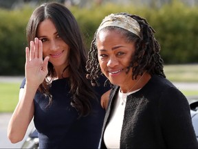 Meghan Markle, left, arrives with her mother Doria Ragland at Cliveden House hotel in the village of Taplow near Windsor on May 18, 2018, the eve of her wedding to Prince Harry. (STEVE PARSONS/AFP/Getty Images)