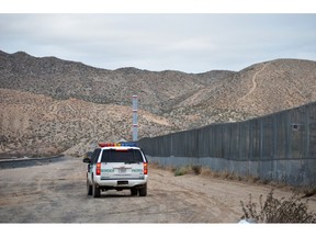 FILE - In this Jan. 4, 2016, file photo, a U.S. Border Patrol agent patrols Sunland Park along the U.S.-Mexico border next to Ciudad Juarez. A 7-year-old girl who had crossed the U.S.-Mexico border with her father, died after being taken into the custody of the U.S. Border Patrol, federal immigration authorities confirmed Thursday, Dec. 13.
