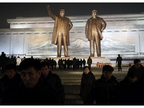 North Korean leave after paying respect to the bronze statues of their late leaders Kim Il Sung and Kim Jong Il at Mansu Hill Grand Monument in Pyongyang, North Korea, Sunday, Dec. 16, 2018. Many North Koreans are marking the seventh anniversary of the death of leader Kim Jong Il with visits to the statues and vows of loyalty to his son, Kim Jong Un.