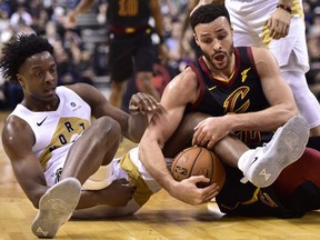 Raptors forward OG Anunoby (left) battles for the ball against Cavaliers forward Larry Nance Jr. (22) during first half NBA action in Toronto on Friday, Dec. 21, 2018.