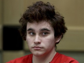 In this Tuesday, Nov. 27, 2018 file photo, Florida school shooting suspect Nikolas Cruz sits in the courtroom for issues dealing with procedural motions at the Broward Courthouse in Fort Lauderdale, Fla. There were plenty of missteps in communication, security and school policy before and during the Florida high school massacre that allowed a gunman to kill 17 people. The Marjory Stoneman Douglas High School Public Safety Commission will consider proposals Wednesday, Dec. 12, 2018, and Thursday, Dec. 13, including whether to arm trained teachers who volunteer.
