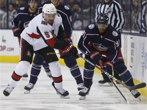 Ottawa Senators' Cody Ceci, left, and Columbus Blue Jackets' Anthony Duclair chase the puck during the second period of an NHL hockey game Monday, Dec. 31, 2018, in Columbus, Ohio.