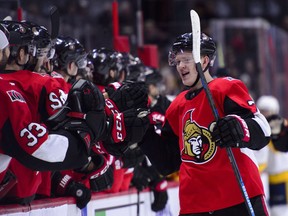 Senators rookie forward Brady Tkachuk is congratulated at the bench after scoring a first period goal against the Nashville Predators in Ottawa on Monday night. (Sean Kilpatrick/The Canadian Press)