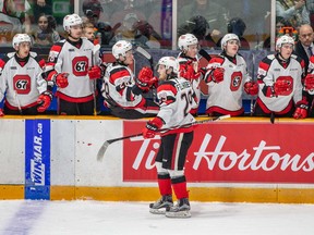 Tye Felhaber gets high-fived at the 67's bench after scoring his 36th goal of the season in last night's win over the Flint Firebirds. (Valerie Wutti photo)