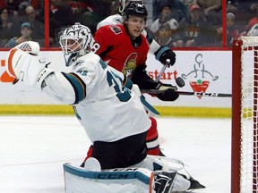 Senators winger Ryan Dzingel watches his shot go over the shoulder of Sharks goaltender Martin Jones during the second period.