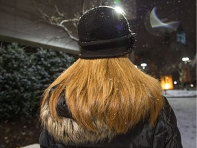 A victim of Dr. Vincent Nadon, who read a victim impact statement in court, waits outside the Ottawa Courthouse after Nadon entered a plea of guilty to many sex crimes.