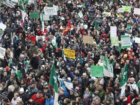 Thousands rally in downtown Ottawa on Saturday to protest Ontario government cuts to French-language services.
