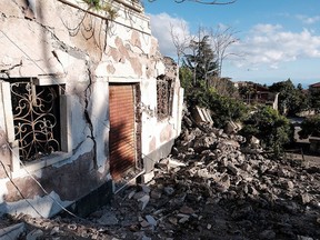 This picture taken on Dec. 26, 2018 shows damaged buildings in Zafferana Etnea near Catania.