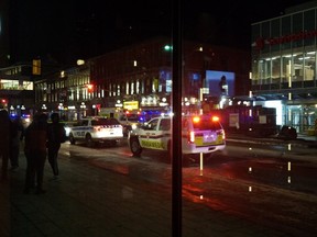 Police vehicles descended on Rideau Street late Sunday night.