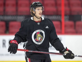 Thomas Chabot waits for a drill to begin as the Ottawa Senators practice at Canadian Tire Centre on Monday.
