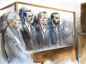 Defence lawyer Gary Clewley, from left, with Toronto Police Consts. Joshua Cabero, Leslie Nyznik and Sameer Kara at 2201 Finch court on February 19, 2015.
