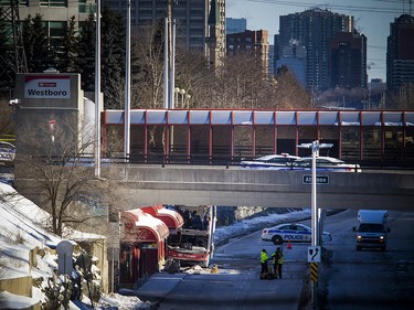 Ottawa police have the area around the Westboro transit station cordoned off with police tape and cruiser's Saturday Jan. 12, 2019, while the collision is investigated. Three people were killed and many were injured after an OC Transpo double-decker bus crashed on the transit way Friday afternoon.