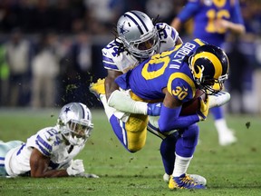 LOS ANGELES, CA - JANUARY 12: Jaylon Smith #54 of the Dallas Cowboys tackles Todd Gurley #30 of the Los Angeles Rams in the second half in the NFC Divisional Playoff game at Los Angeles Memorial Coliseum on January 12, 2019 in Los Angeles, California.  (Photo by Sean M. Haffey/Getty Images)