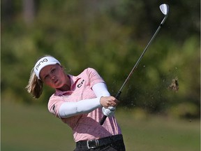 Brooke Henderson of Smiths Falls follows through on her second shot on the fourth hole during the third round of the Diamond Resorts Tournament of Champions on Saturday.