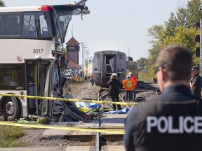 The front of a double-decker bus was sheared off in a collision with a train on Sept. 18, 2013. Six people from the bus, including the driver, lost their lives.