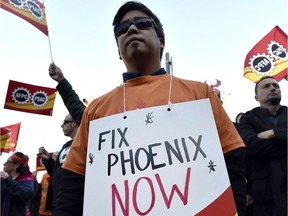 Public servants protest over problems with the Phoenix pay system outside the Office of the Prime Minister and Privy Council in Ottawa on October 12, 2017.