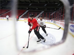 Matt Duchene, left, and Thomas Chabot are seen here during the Senators' skate at Canadian Tire Centre on Tuesday.