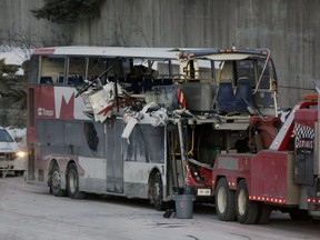 The OC Transpo bus involved in the crashat Westboro Station was towed from the scene, revealing extensive damage, on Jan. 12, 2019.