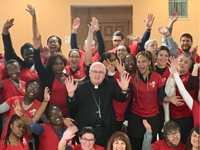 Archibishop Terrence Prendergast, middle, is surrounded by 2019 World Youth Day participants from the Ottawa region during a Jan. 13 sendoff Mass at St. Joseph's Parish in Orléans.