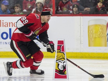 Ottawa Senator Mikkel Boedker competes in the puck control relay.