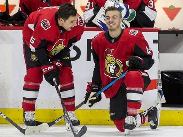 Ottawa Senator J.G. Pageau, right, shares a laugh with teammate Cody Ceci.