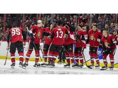 Ottawa Senators teammates congratulate Nick Paul after he set a team record for the hardest shot of 108.3 m.p.h.