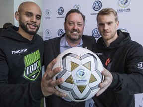 From left, York9's Kyle Porter, CPL commissioner, David Clanachan and Forge FC's Kyle Becker pose for a photo at Tuesday's event.. (CRAIG ROBERTSON/Toronto Sun)