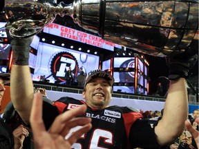 Nolan MacMillan #66 of the Ottawa Redblacks hoists the Grey Cup following the 104th Grey Cup Championship Game against the Calgary Stampeders at BMO Field on November 27, 2016 in Toronto, Canada.