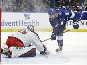 Tampa Bay Lightning center Steven Stamkos (91) looks for a loose puck in front of Columbus Blue Jackets goaltender Sergei Bobrovsky (72) during the second period of an NHL hockey game Tuesday, Jan. 8, 2019, in Tampa, Fla.