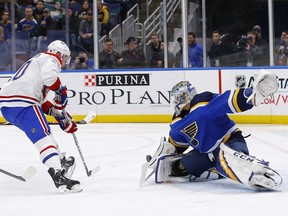 Blues goaltender Jordan Binnington stops a shot by Canadiens' Nicolas Deslauriers during first-period action in St. Louis on Thursday night.
