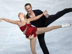 In this Nov. 15, 2013, file photo, Caydee Denney and John Coughlin perform during their pairs short program during the international Eric Bompard Trophy competition in Paris.