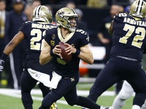 New Orleans Saints quarterback Drew Brees (9) works in the pocket against the Philadelphia Eagles in the first half of an NFL divisional playoff football game in New Orleans, Sunday, Jan. 13, 2019.
