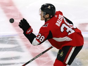 The Ottawa Senators' Rudolfs Balcers gloves down a bouncing puck against the Carolina Hurricanes on Sunday, Jan. 6, 2019.