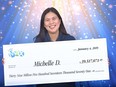 Surrey's Michelle De Roma with her Lotto Max cheque for $39.5 million.