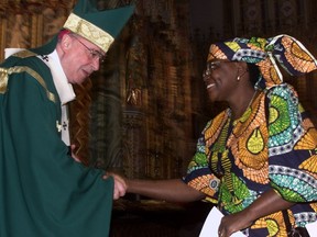 The Homelands Mass is a long-standing tradition at Notre Dame Cathedral in Ottawa. in this file photo from January 2000, Marcel Gervais, then Ottawa Archbishop, greets Ebi Obaro.